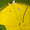 Picture of Real Madrid 2024 Double Sided Jacket Black & Red/Yellow