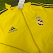 Picture of Real Madrid 2024 Double Sided Jacket Black & Red/Yellow